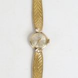 TUDOR - a lady's Vintage gold plated mechanical bracelet watch, silvered dial with gilt baton hour