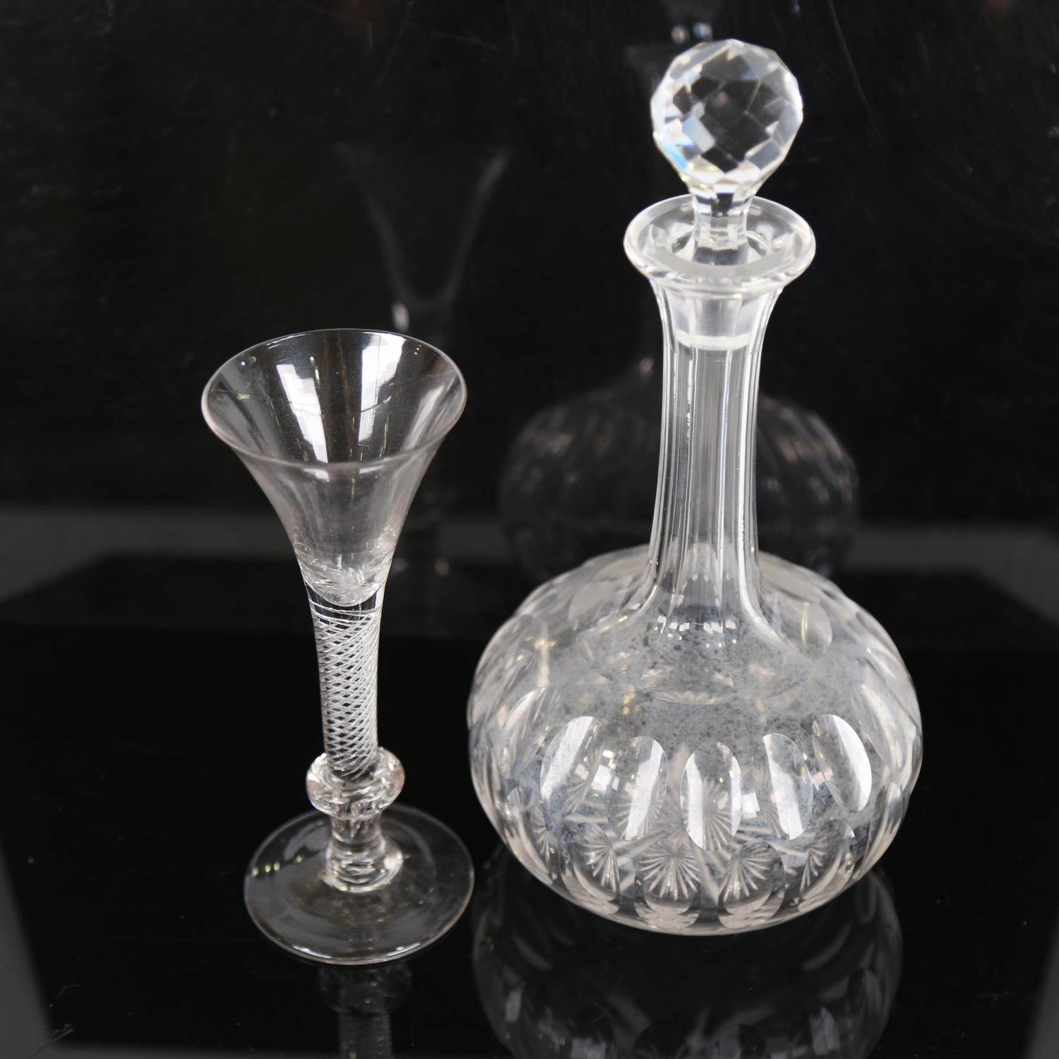 An 18th century cordial glass, with funnel-shaped bowl and air twist stem, height 18cm, and a cut-