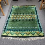 A large Scandinavian Rya rug, long wool pile, in green yellow and blue, 208cm x 144cm Some marks