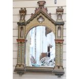 A decorative painted wall mirror, modelled as an entrance to a castle, height 80cm