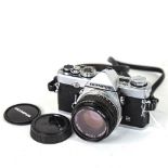 OLYMPUS - a Vintage OM-1n 35mm single lens reflex camera, with Olympus 50mm 1:1.8 lens and Hunter