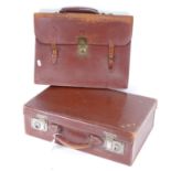 A Turners suitcase with lined interior, and a leather briefcase