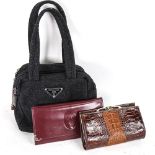 A Prada Milano purse, a Cartier leather purse and a crocodile skin purse