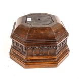 A Victorian Gothic octagonal oak plinth, possibly a church font pedestal, with carved frieze, 33cm