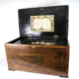 A large Antique Swiss rosewood music box, playing 12 airs with 6 bells, with inlaid decoration,