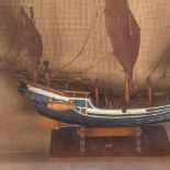 A carved and painted model 3-masted ship, in glazed wall-mounted display case, height 35cm overall