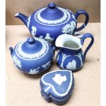 Wedgwood blue Jasperware teapot, height 14cm, matching sugar bowl, a box and a jug (A/F)