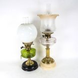 2 oil lamps with moulded glass fonts, funnels and shades, largest height 60cm overall