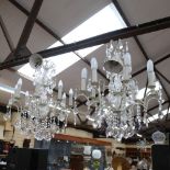 A pair of large distressed wrought-metal 8-branch chandeliers, with glass drops, branch length 27cm,