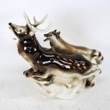 A Royal Dux stag and wolf sculpture, height 22cm