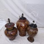 3 similar terracotta table lamps and shades, with acanthus leaf decoration, by The Red Mud Company