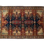 A red ground Afghan rug, 220cm x 155cm