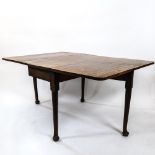 An early 19th century mahogany drop leaf dining table, on cabriole legs with pad feet, W101cm,