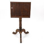 An Arts and Crafts oak music stand, the panel engraved with IAS