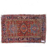 A small Antique red ground Hamadan rug, 133cm x 86cm