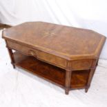 A walnut and crossbanded mahogany 2-tier coffee table of shaped form, with 2 frieze drawers,