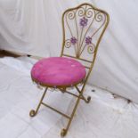 A gilt-metal folding bedroom chair