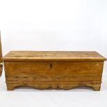 An Antique Continental pine blanket chest of large size, with shaped apron, on bracket feet, L188cm,