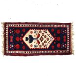 A small red and blue ground Turkey design runner, 120cm x 62cm