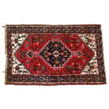 A red and blue ground Afghan design rug, 204cm x 134cm