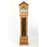 A modern walnut longcase clock, with moon phase and 3-train movement, W220cm