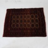 A red ground Tekki design rug, 122cm x 95cm