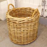 A large woven wicker 2-handled basket, W60cm, H55cm