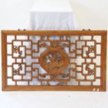 A Chinese elm relief carved and pierced rectangular panel, L97cm, H58cm