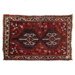 A small red ground Afghan rug, 126cm x 82cm
