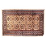 A cream and red ground rug, 192cm x 126cm