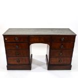 An Antique mahogany writing desk, with a green leather skiver, and 9 fitted drawers, L136cm,