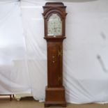 A George III oak 8-day longcase clock, by B Bell Uttoxeter, having a 12" arch-top painted dial and 2