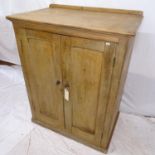 An Antique pine side cabinet, with fitted shelves and 2 panelled doors, W98cm, H124cm, D61cm