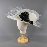 PETER BETTLEY LONDON - Ivory/neutral occasion hat, with black flower and frayed mesh detail,