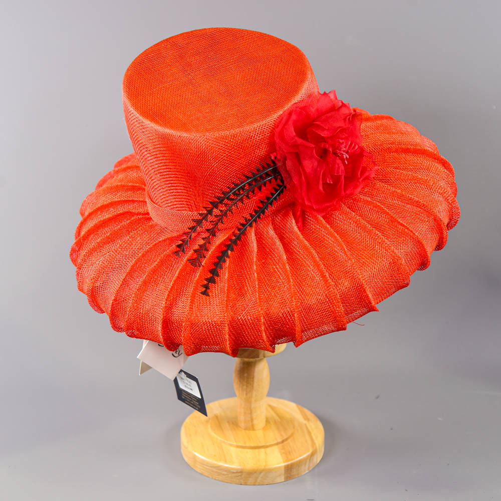 PETER BETTLEY LONDON - Coral red occasion hat, with flower and black feather detail, angled crown, - Image 2 of 7