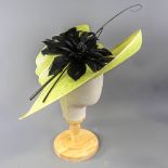 PETER BETTLEY LONDON - Lime green occasion hat, with black feather flower and twirl and stick