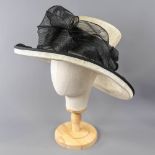 NIGEL RAYMENT - Cream and black occasion hat, with twirl detail and NR hat pin, internal