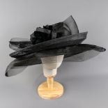 PETER BETTLEY LONDON - Black occasion hat, with feather and twirl detail, internal circumference