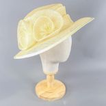 GINA - Yellowish cream occasion hat, woven fibre flower detail, internal circumference 55cm, brim