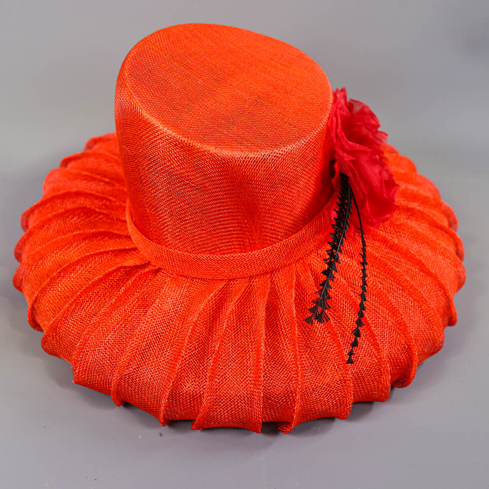 PETER BETTLEY LONDON - Coral red occasion hat, with flower and black feather detail, angled crown, - Image 6 of 7