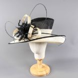 Black and ivory occasion hat, with feather and twirl detail, internal circumference 55cm, brim width