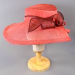 PETER BETTLEY LONDON - Coral pink and burgundy/brown occasion hat, with twirl detail, internal