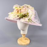 NIGEL RAYMENT - Soft lilac occasion hat, with flower and twirl and net and hat pin detail,