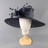 PETER BETTLEY LONDON - Dark navy blue occasion hat, with feather and twirl detail, internal