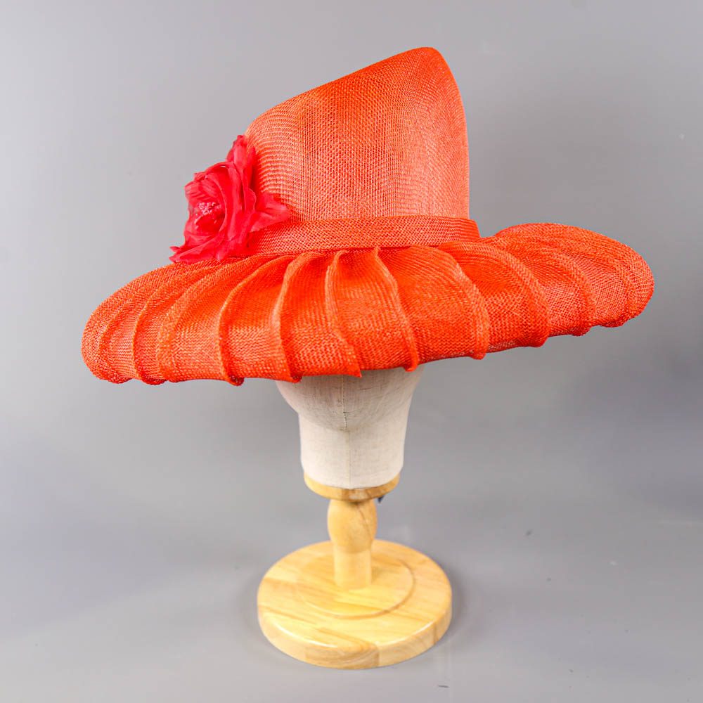 PETER BETTLEY LONDON - Coral red occasion hat, with flower and black feather detail, angled crown, - Image 3 of 7