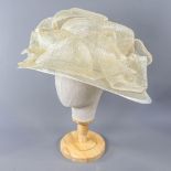 A HAT STUDIO DESIGN - Champagne and silver thread occasion hat, with frill detail, internal