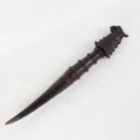 An African horn-tipped implement, with carved phoenix handle, overall length 44cm