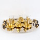 A very ornate Moroccan gilt-metal tea set, comprising large tea tray and set of 6 tea cups and