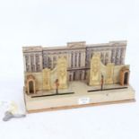 An early 20th century lithograph tinplate clockwork toy diorama, the guard at Buckingham Palace,