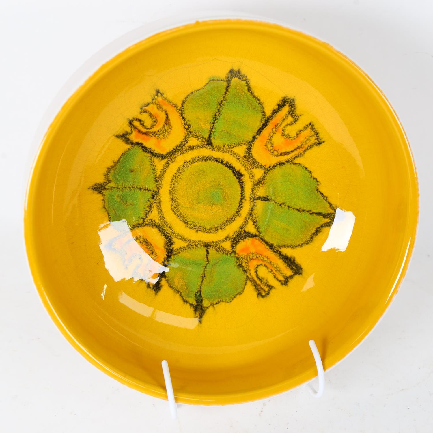 A Poole Pottery yellow ground fruit bowl, model no. 89, diameter 22cm